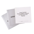 TableTopics Airstream Live Riveted Conversation Cards fanned out with question - Music festival, hot air balloon festival, or food and wine festival?