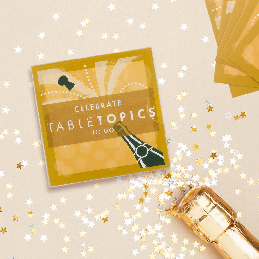 TableTopics Celebrate To Go with champagne