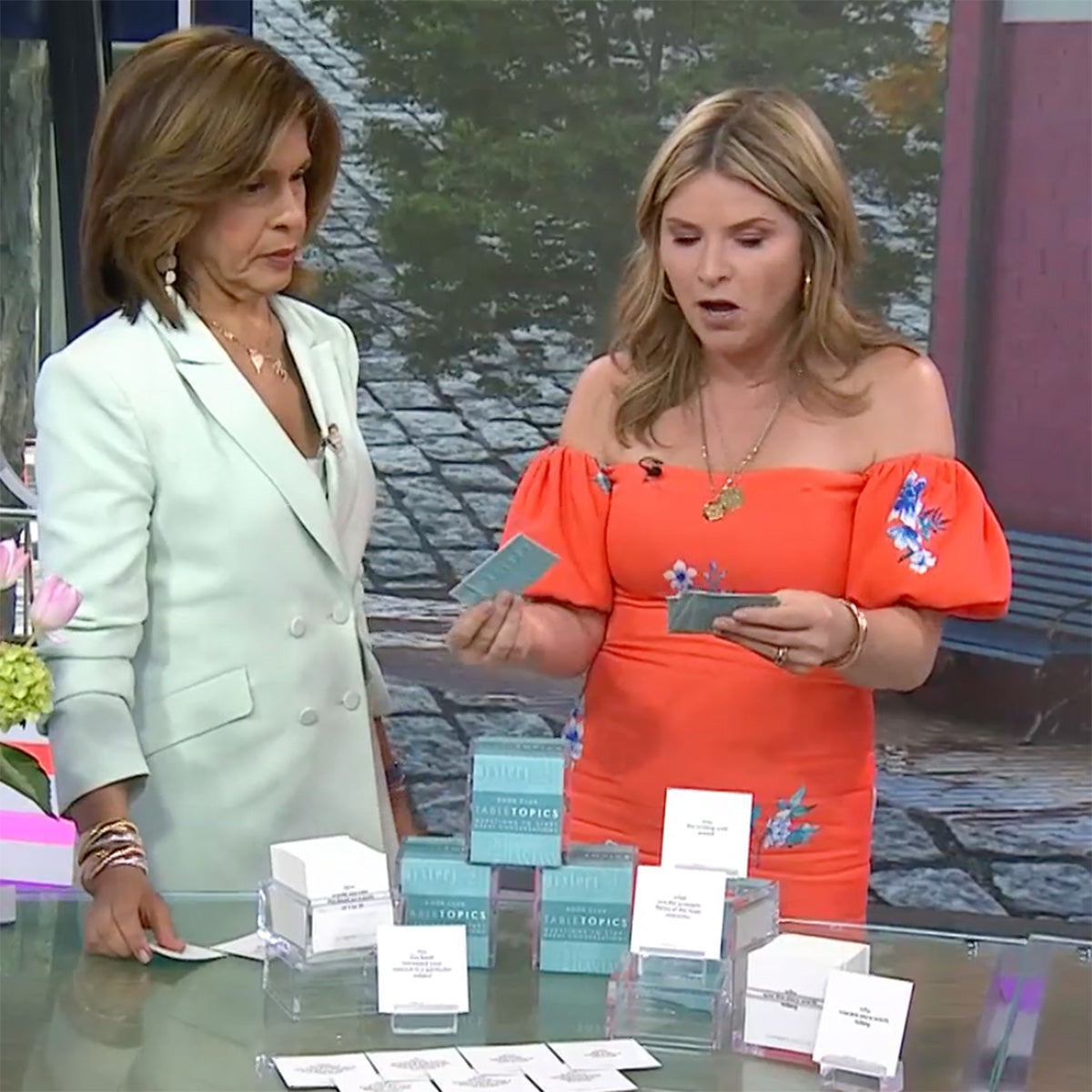 Jenna Bush Hager holding TableTopics Book Club cards and showing them to Hoda on TODAY