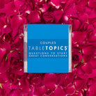 TableTopics Couples Conversation Card set surrounded by rose petals