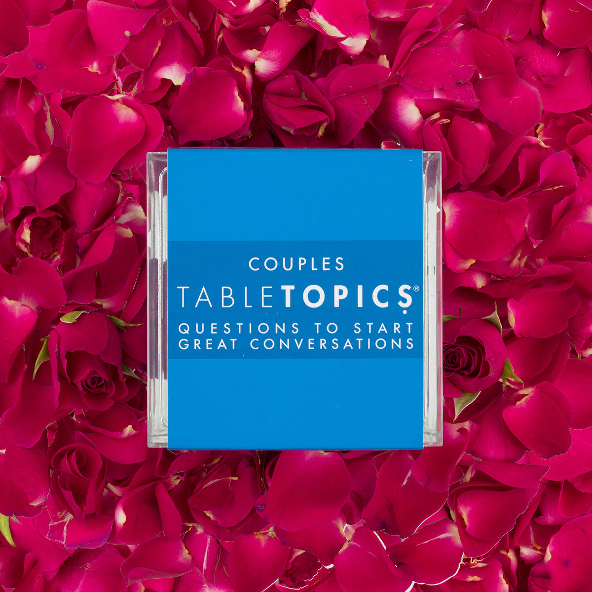 TableTopics Couples Conversation Card set surrounded by rose petals