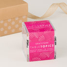 TableTopics Gratitude conversation card set with a gift box in the background