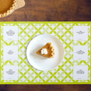 A slice of pie on a plate on a TableTopics Family Paper Placemat