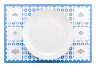 TableTopics Kids Paper Placemat with a plate on top. There are 6 conversation starter questions on the placemat.