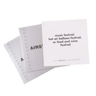 TableTopics Airstream Live Riveted Conversation Cards fanned out with question - Music festival, hot air balloon festival, or food and wine festival?