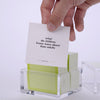 Hand pulling out TableTopics Family cards from the container and showing the questions