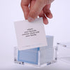 Hand pulling out TableTopics Family Gathering cards from the container and showing the questions