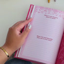 Hands flipping through the pages of the Gratitude Prompted Journal